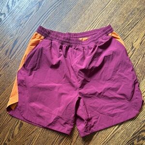 E Peloton burgundy/orange elastic drawstring waist technical fabric shorts. Med